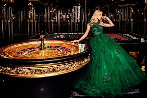 A dramatic shot of winning sevens landing on a slot reel surrounded by shining gold coins, symbolizing big wins.