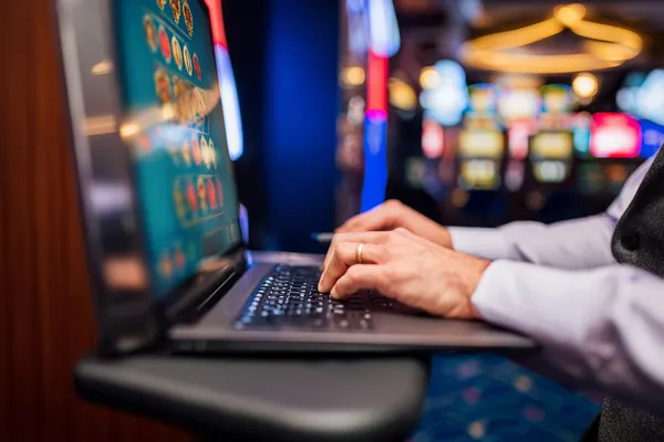 A person using their device against a moody casino-themed background, illustrating the smooth re-entry process at SOYL777.